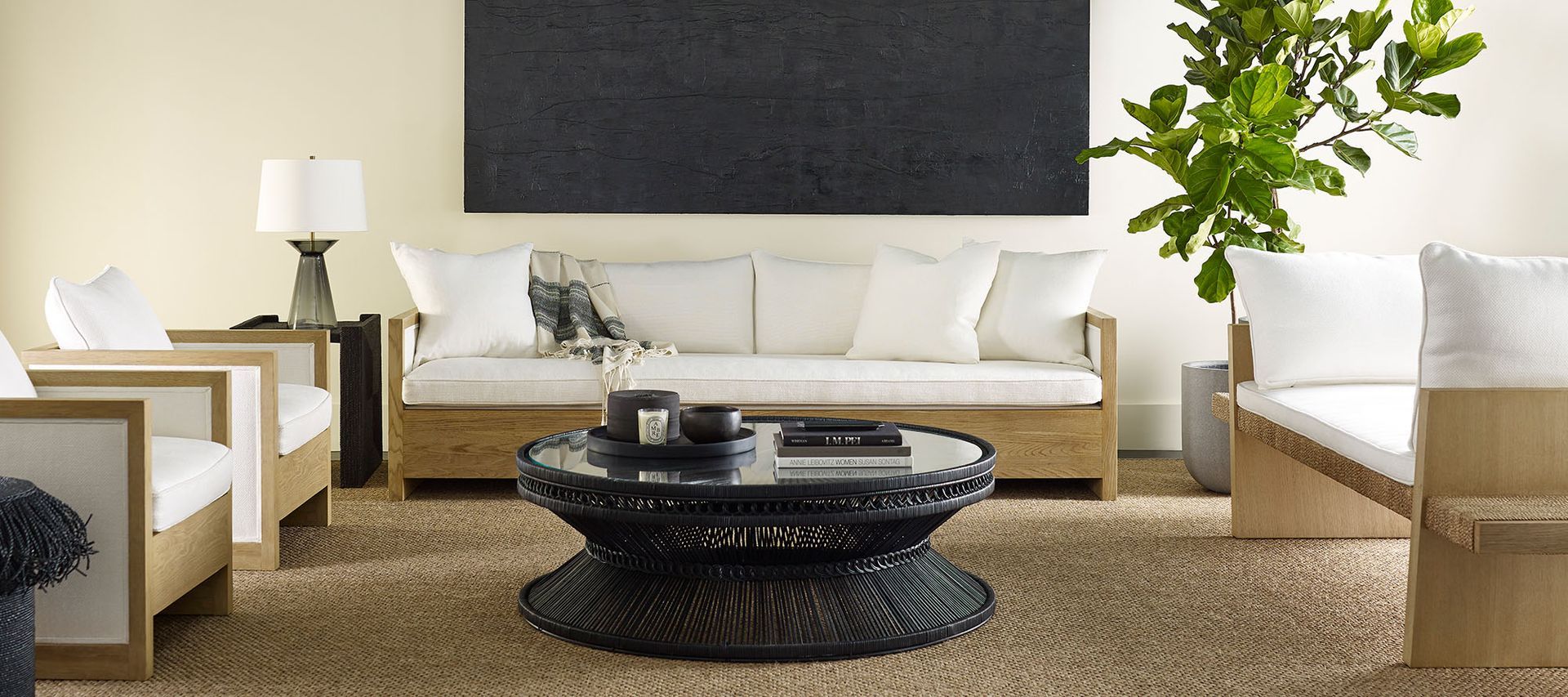 A living room with a couch , chairs and a coffee table