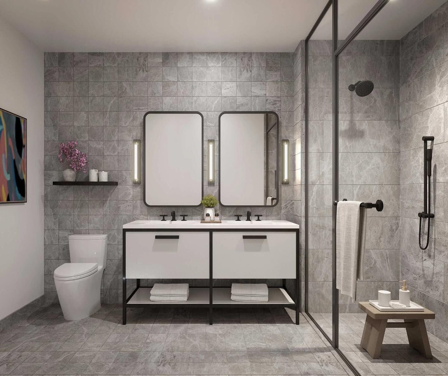 A bathroom with two sinks , a toilet , and a walk in shower.