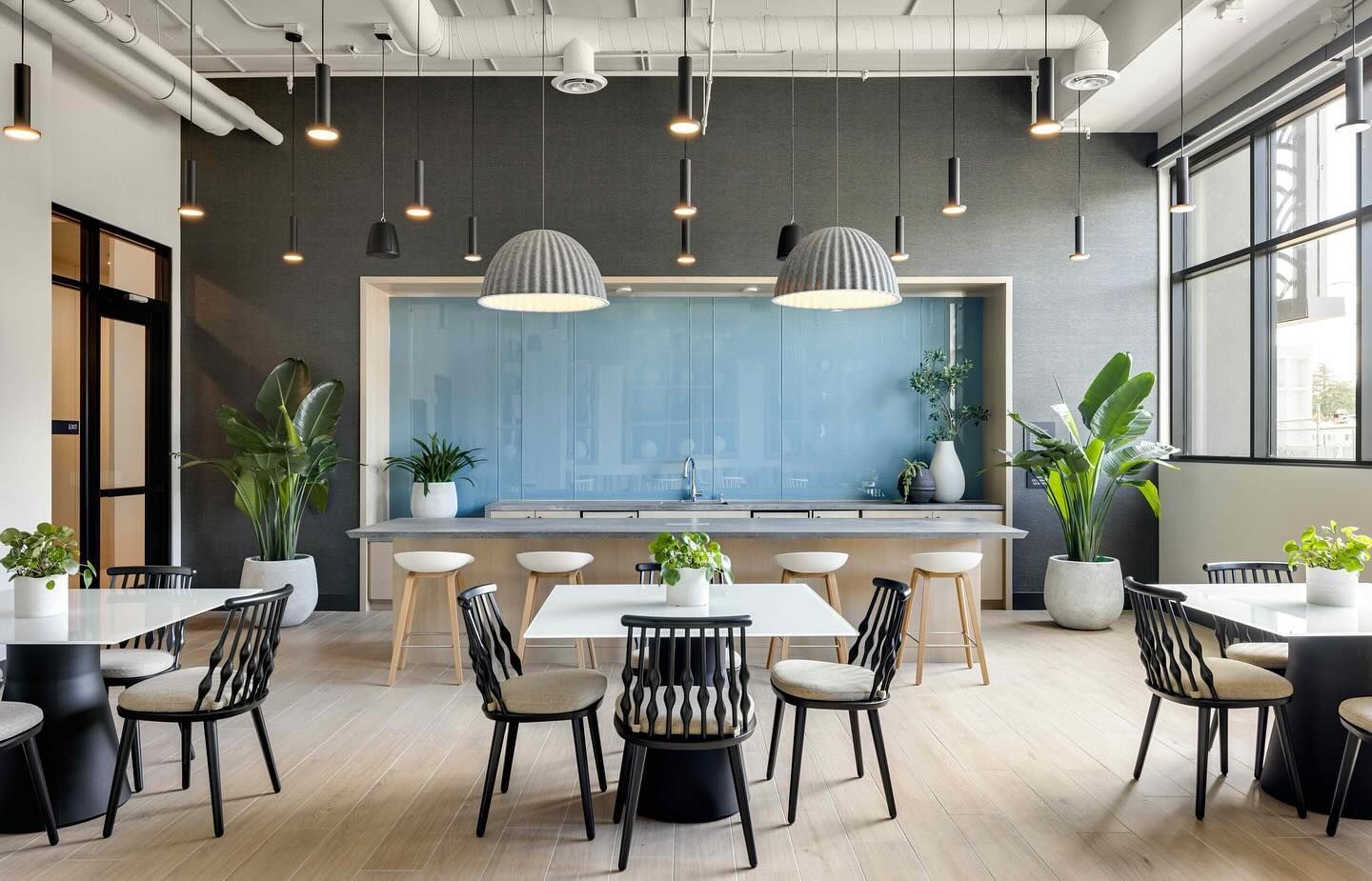 A large room with tables and chairs in it.