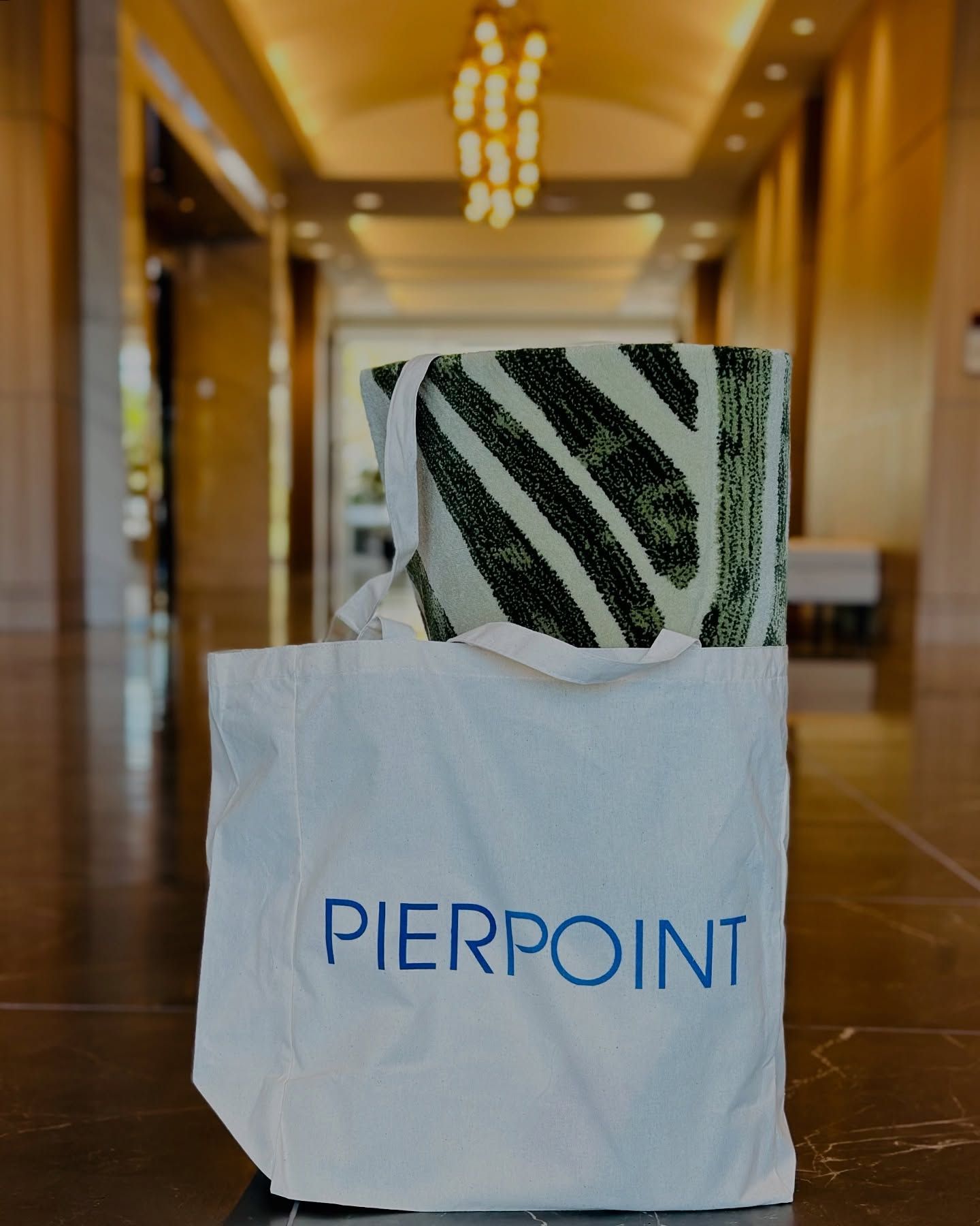 A white tote bag with pierpoint written on it