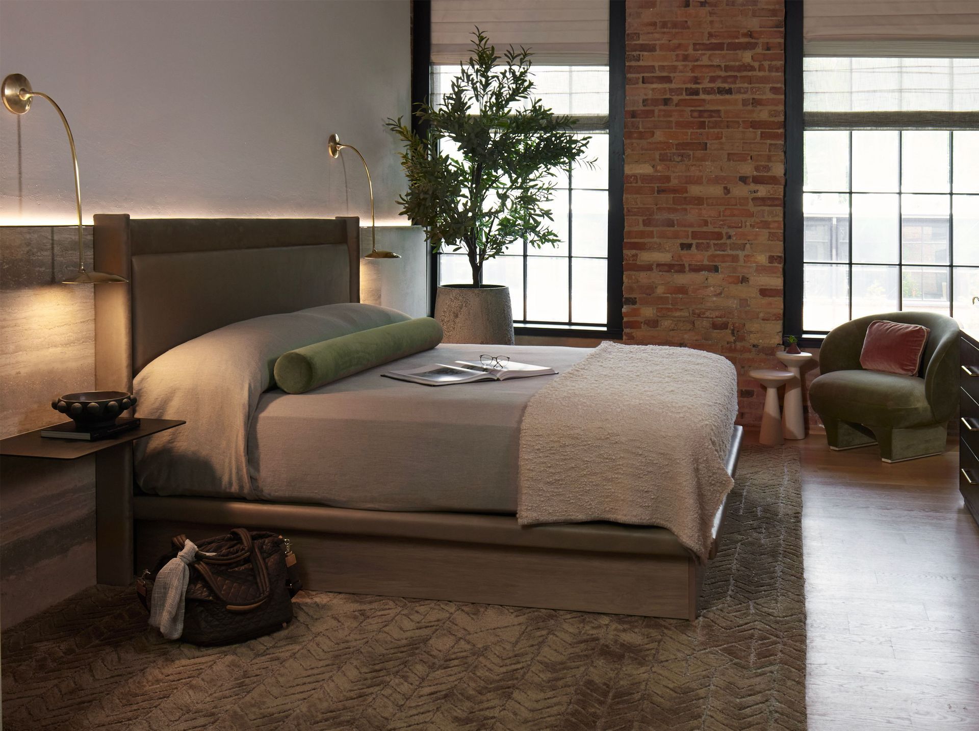A bedroom with a large bed and a chair