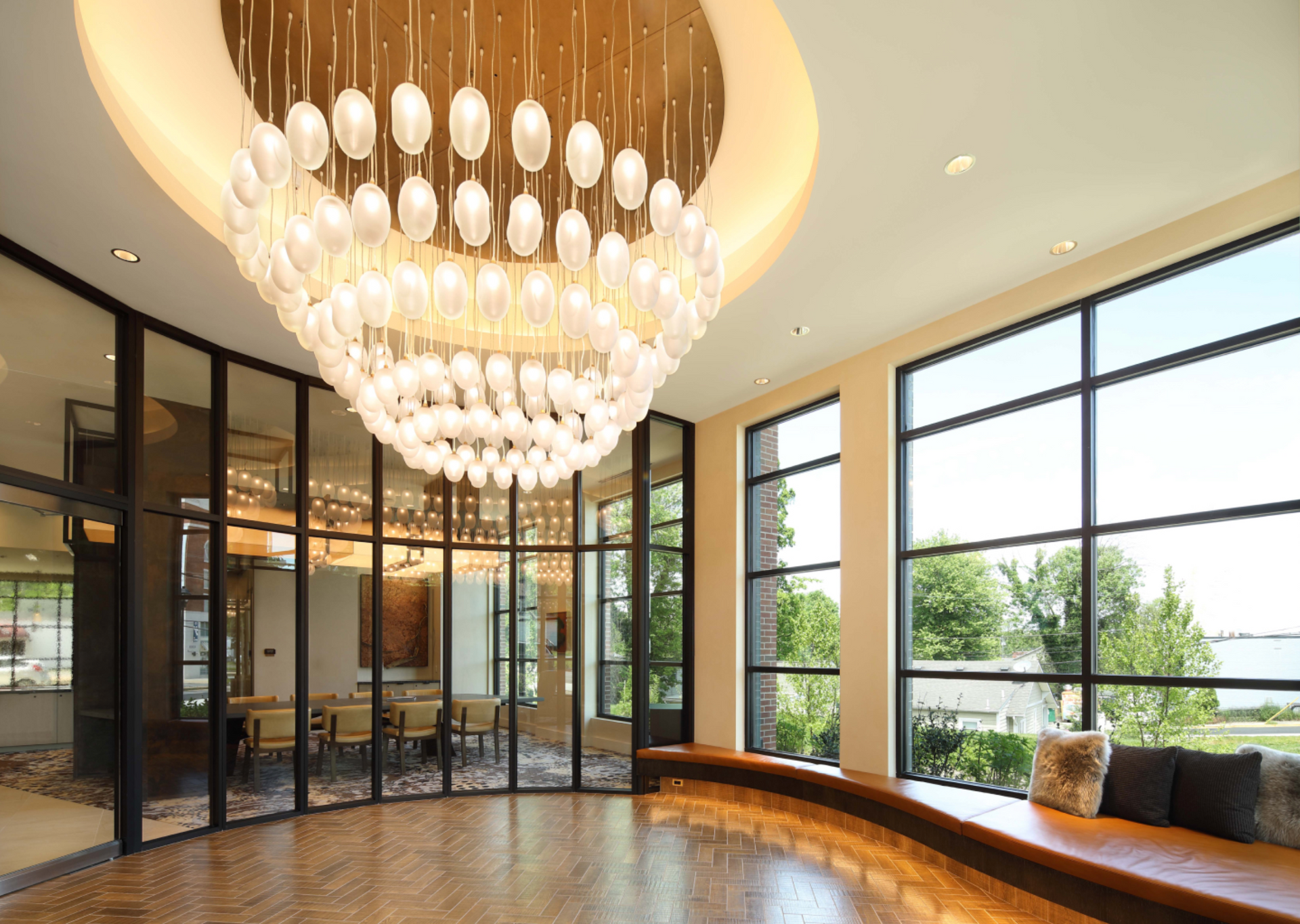 There is a large chandelier in the middle of the room.