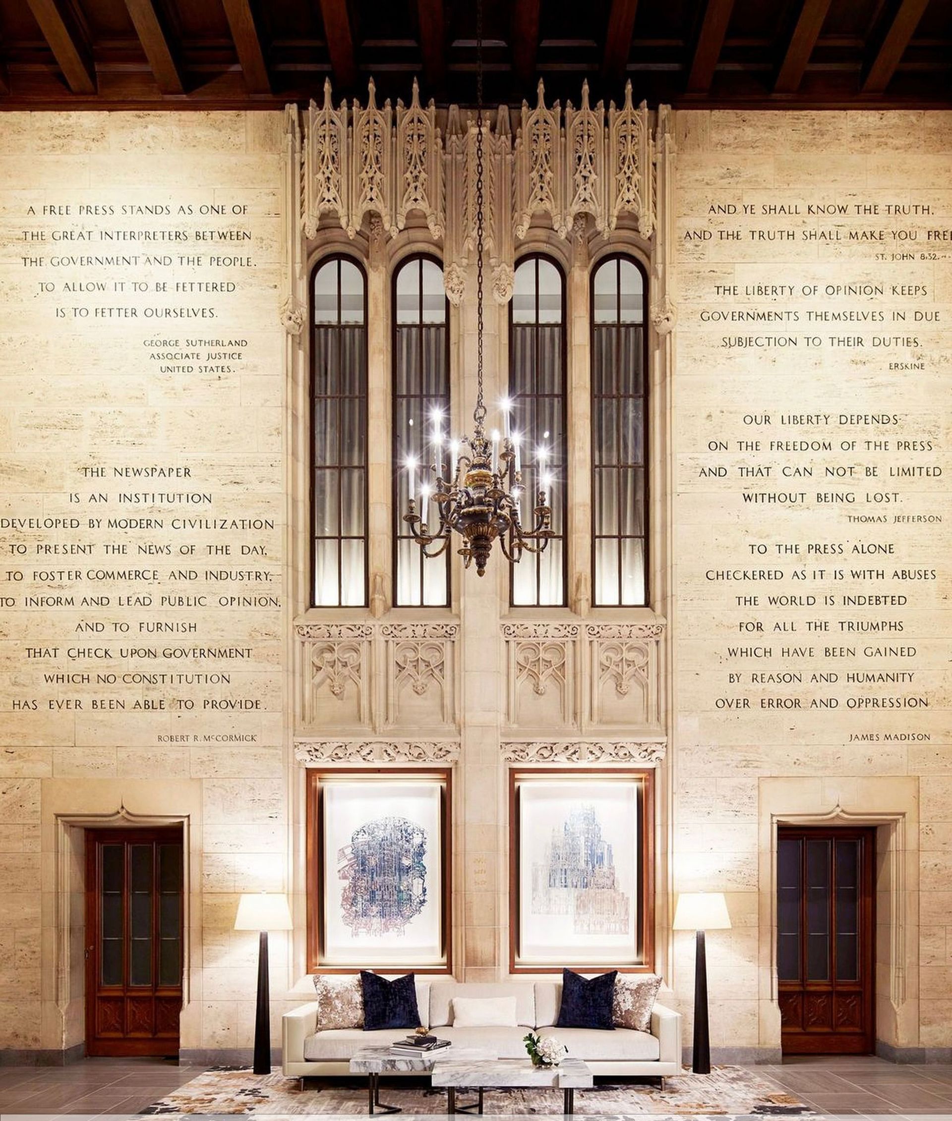 A living room with a couch and a chandelier