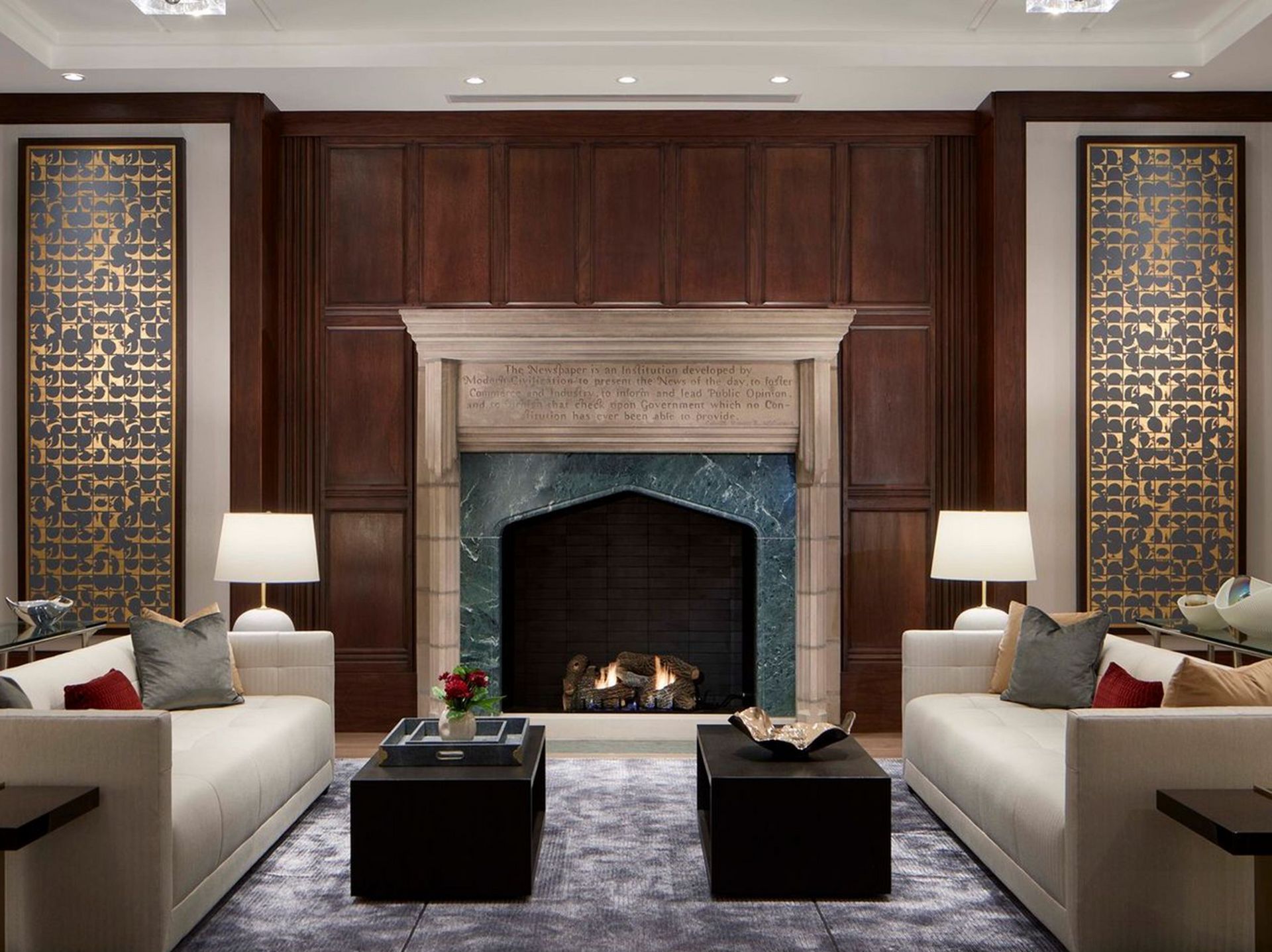 A living room with two couches and a fireplace