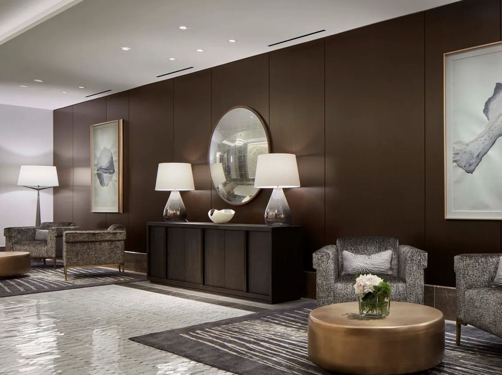 A living room with a round coffee table and chairs