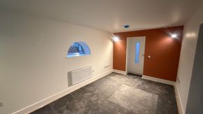 Image showing room in progress of being repainted. Walls, ceiling and woodwork all freshly decorated