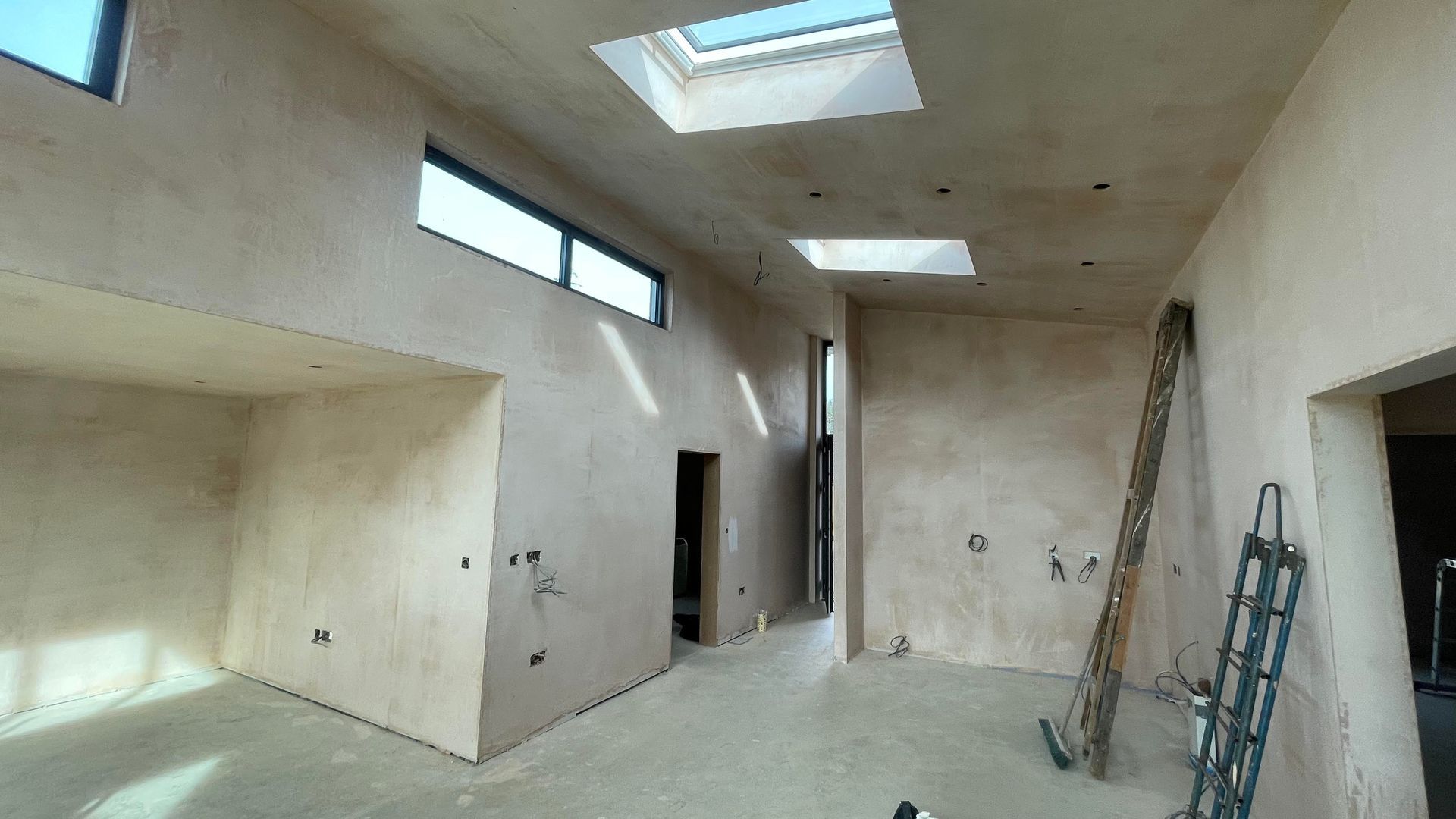 Image of completed & drying plastering in  a room in residential property