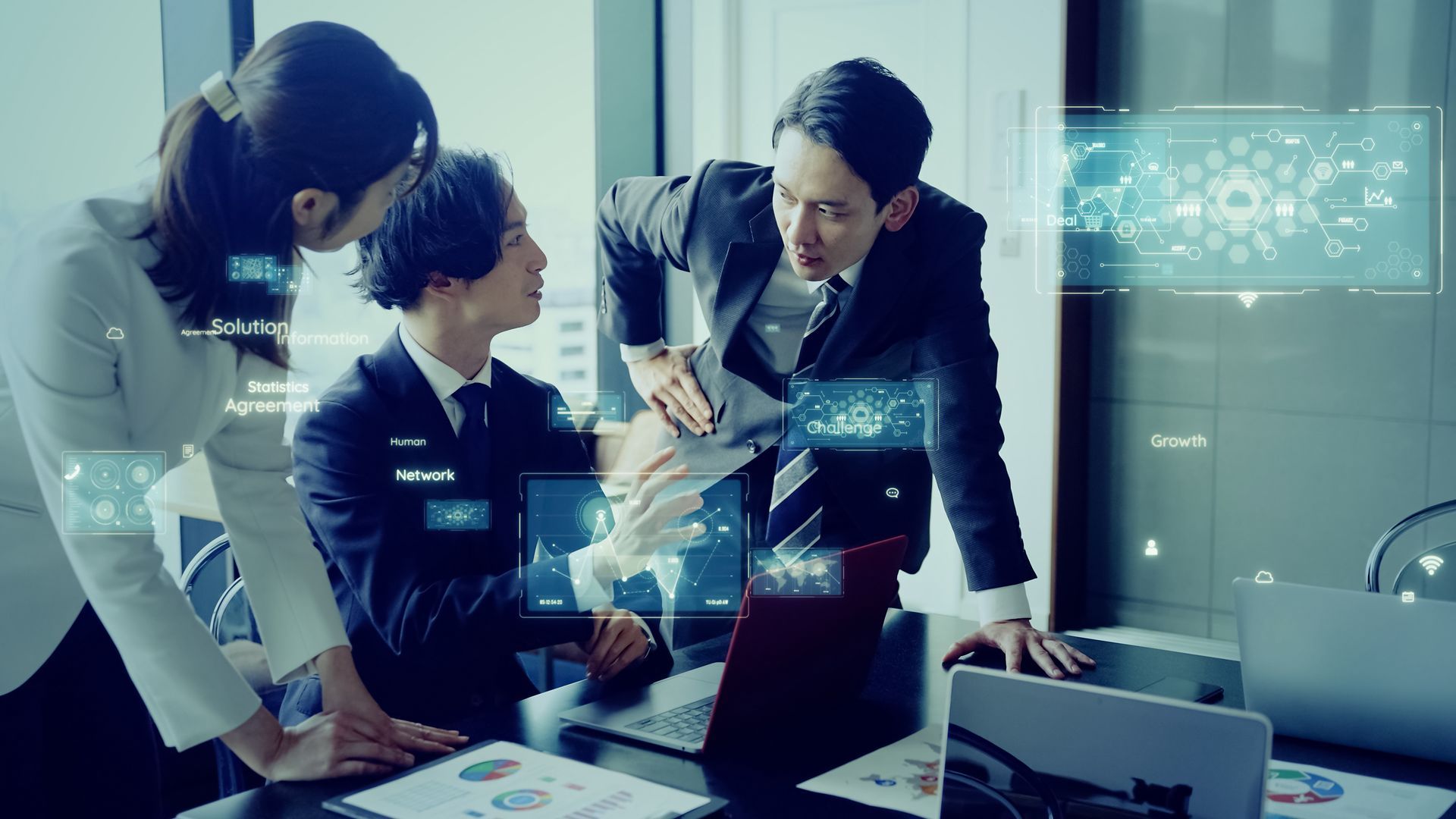 3 people having a conversation in a corporate setting