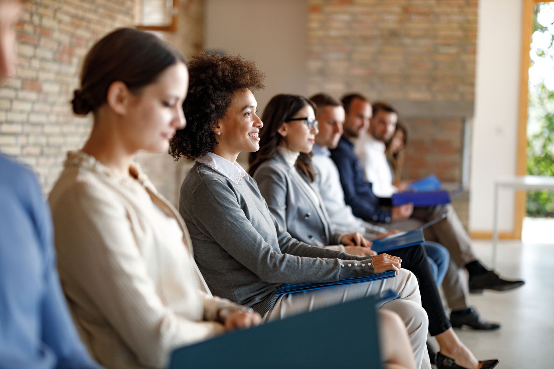 jobseekers sitting in chairs waiting