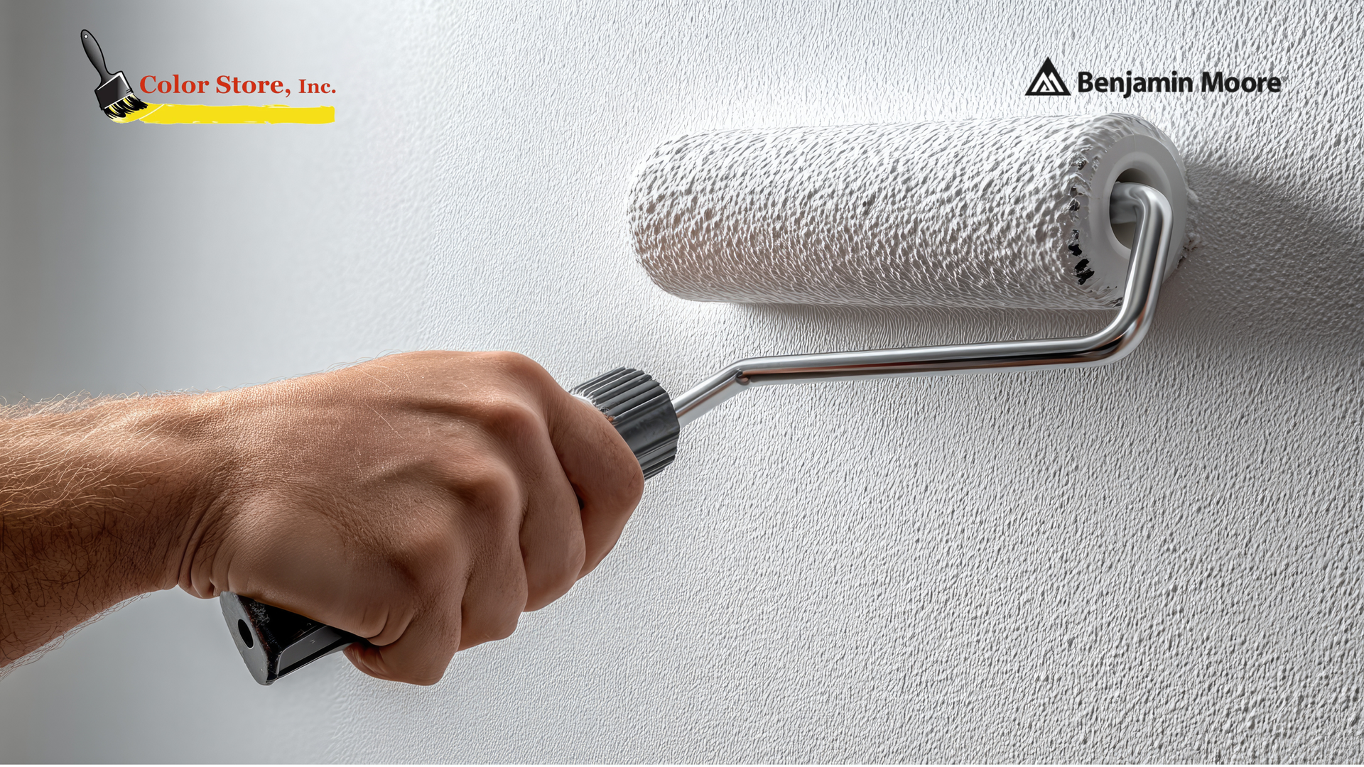 Applying primer to drywall with a roller.