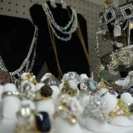 Jewelry display with rings, necklaces, and sparkling silver and gold accessories