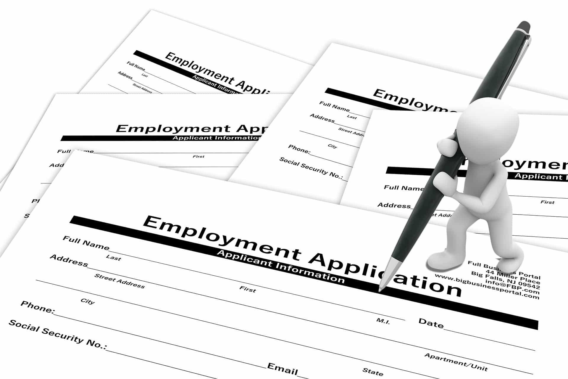 White figure filling out employment applications with a pen.