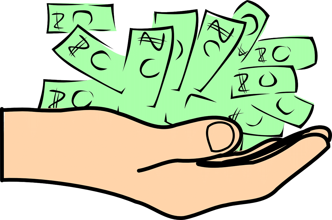 Hand holding a large pile of green cash.