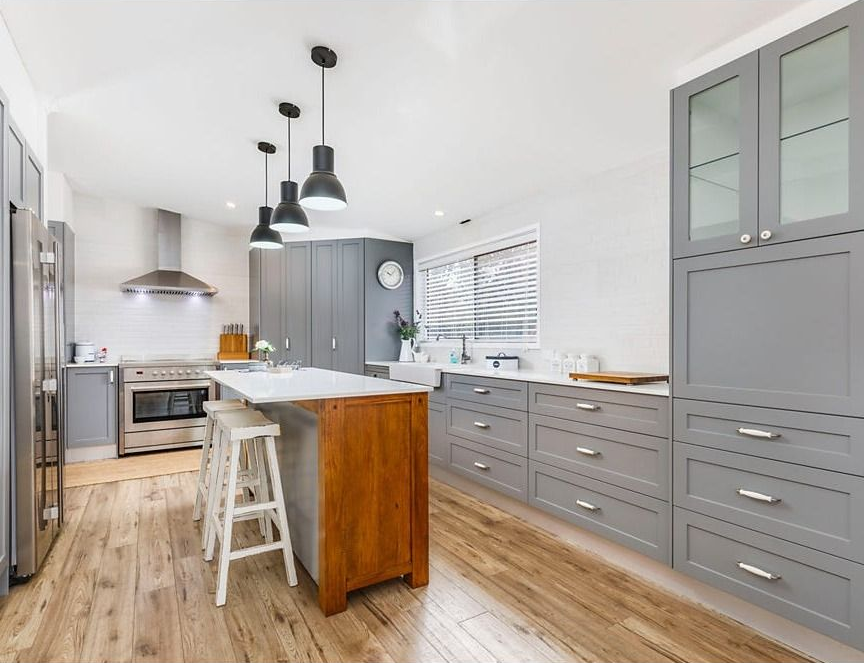 Bright Modern Kitchen with Gray Cabinets, Wood Floors — Rivbuild In Uranquinty, NSW