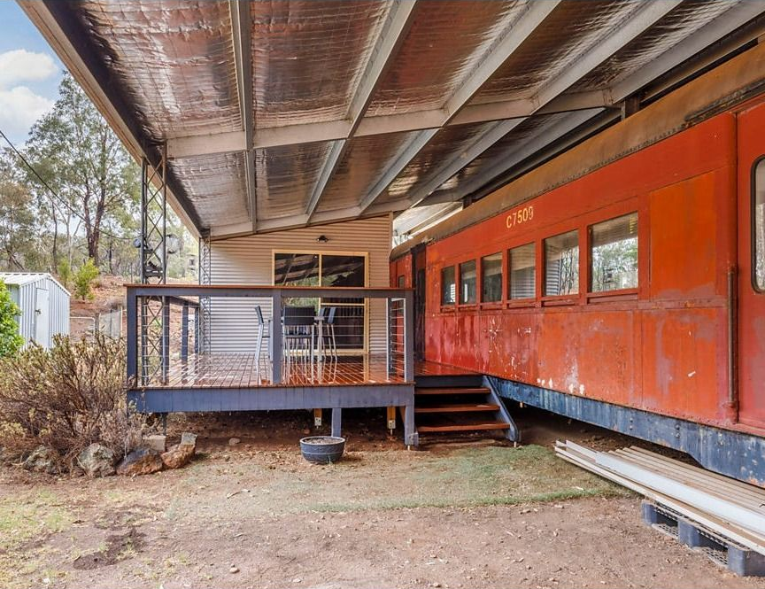 Orange Building Under a Raised Roof with A Small Wooden Porch — Rivbuild In Uranquinty, NSW