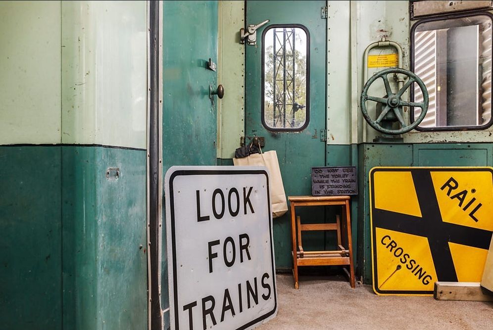 Vintage Railway Interior with “Look for Trains” and “Rail Crossing” Signs — Rivbuild In Uranquinty, NSW