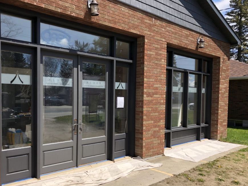 A brick building with a lot of windows and doors