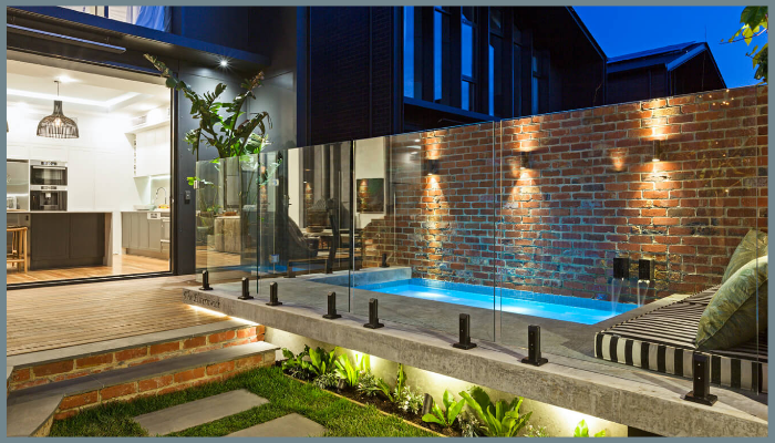 Luxury Canberra home with frameless glass pool fencing, showcasing modern design, uninterrupted views, and high-end aesthetic appeal.