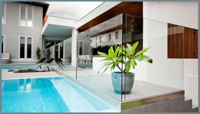 Frameless glass pool fence beside modern pool in Canberra