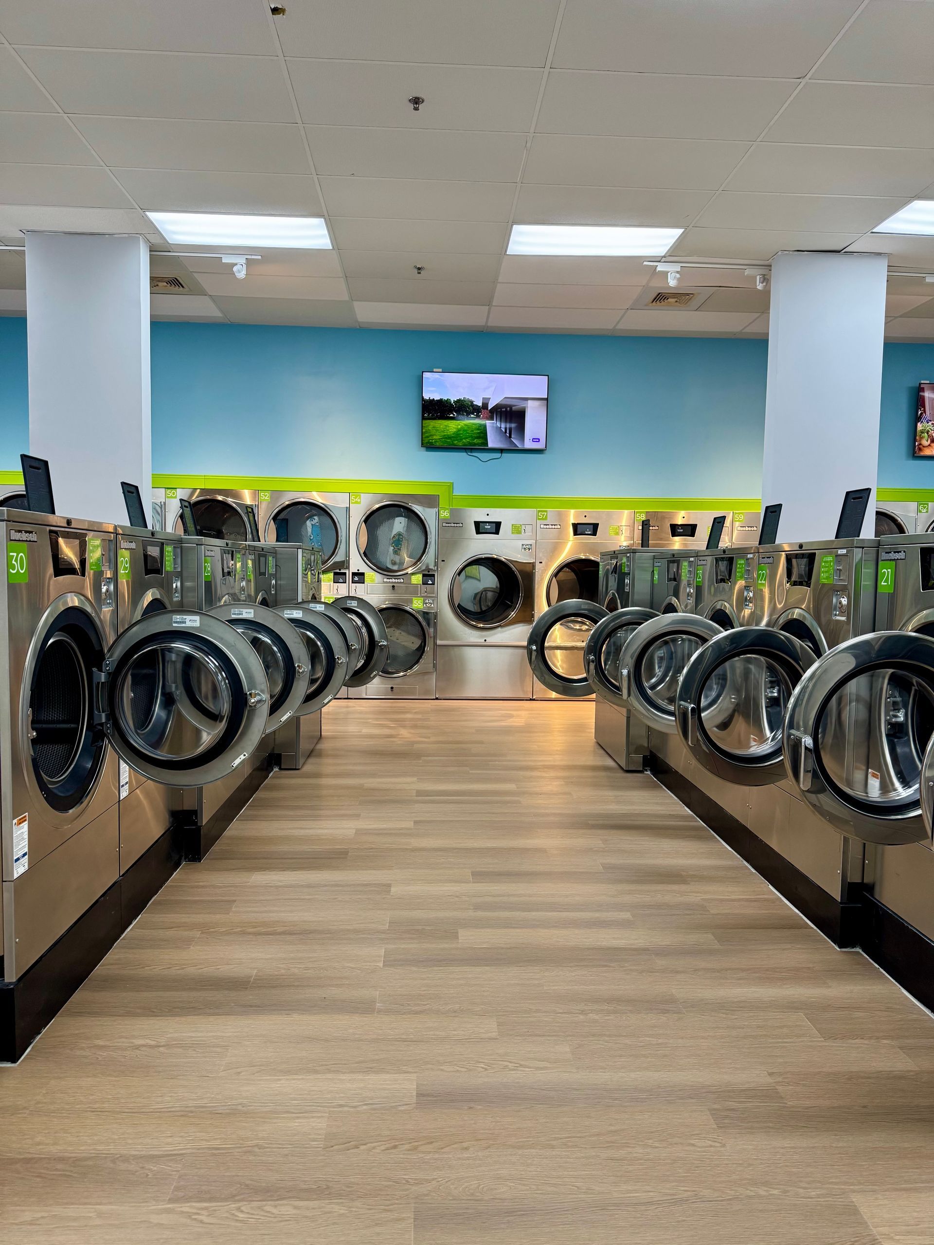 Self service laundry washing and drying machines