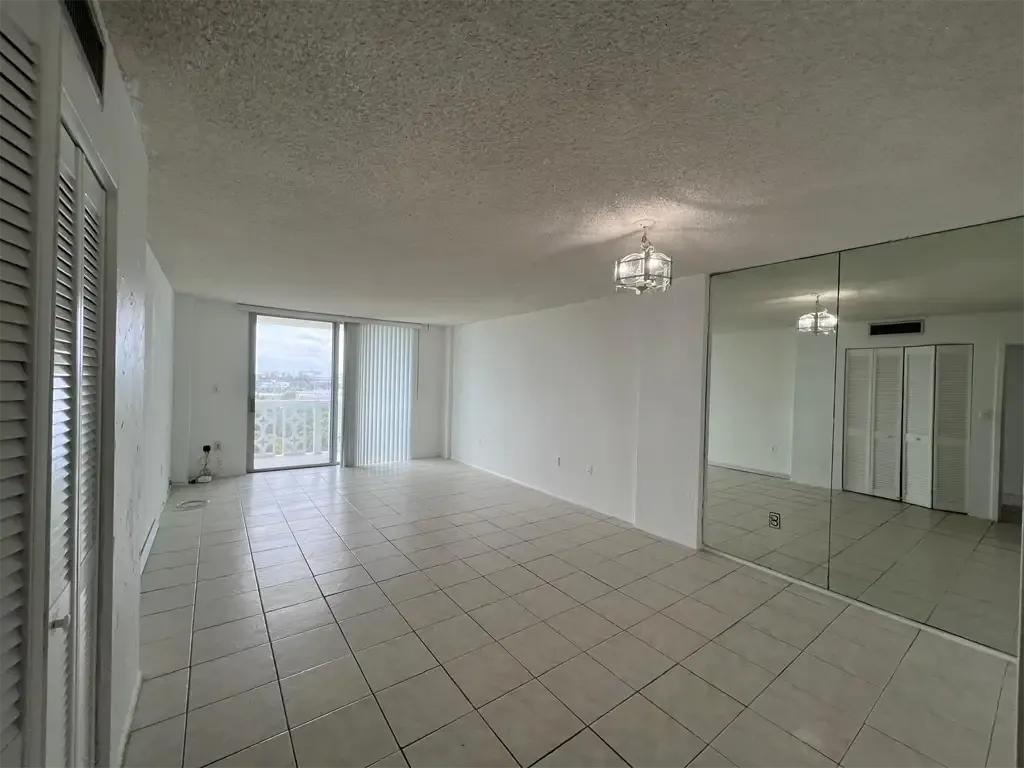 Interior of Unit 703, Ixora Ct, North Miami, FL 33181. Living and dining areas.