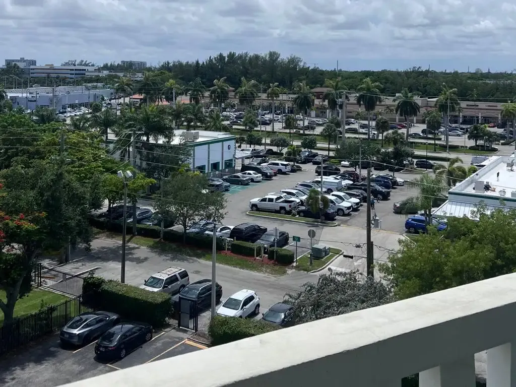 Southwest exterior view from balcony of Unit 703, Ixora Ct, North Miami, FL 33181.