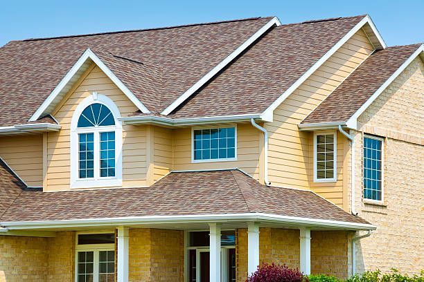 someone installing/ arranging the roof gutter