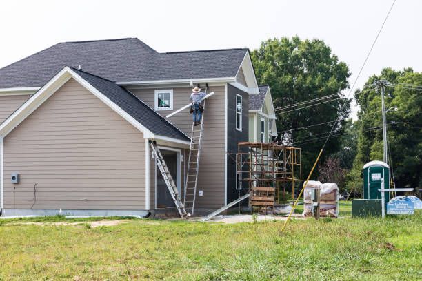 someone installing/ arranging the roof gutter