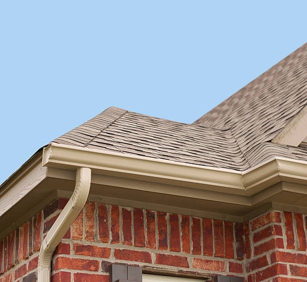 someone installing/ arranging the roof gutter