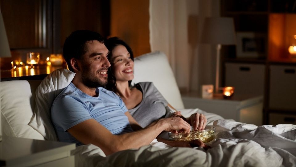 home theater system installation - couple watching a movie