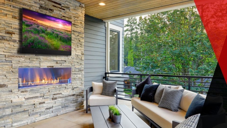 Outdoor patio area featuring a weatherproof TV. weatherproof tv
