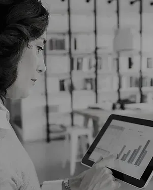 Woman looking at real time SharePoint reporting