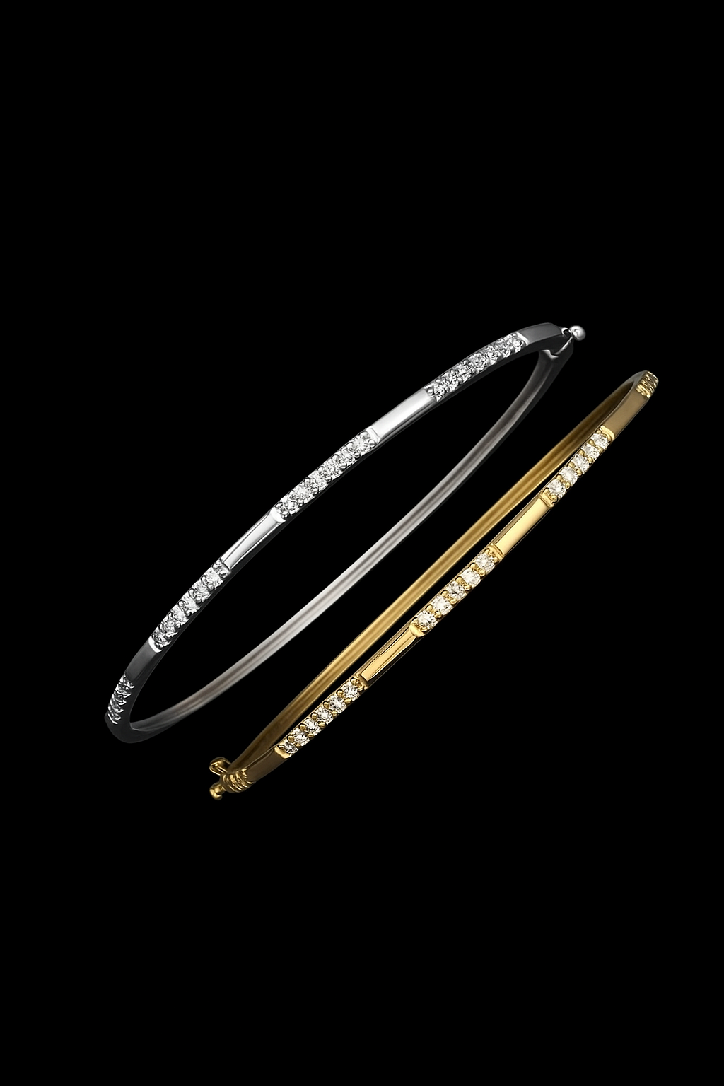 Two diamond bracelets on a black background, one silver and one gold.