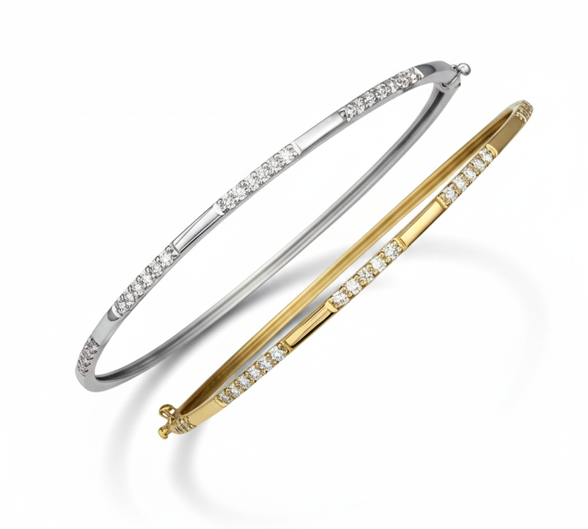 Two diamond-accented gold and silver bangle bracelets, slightly overlapping, against a white background.