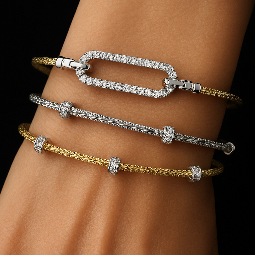 Three gold and silver bracelets on a wrist, featuring diamond accents and a rectangular clasp.