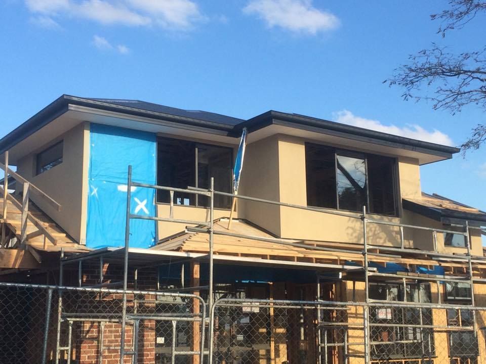 A House Is Being Built With Scaffolding Around It – Dandenong, VIC - Pearl Rendering Services