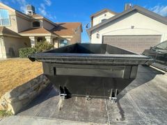 black bag beside the trash can
