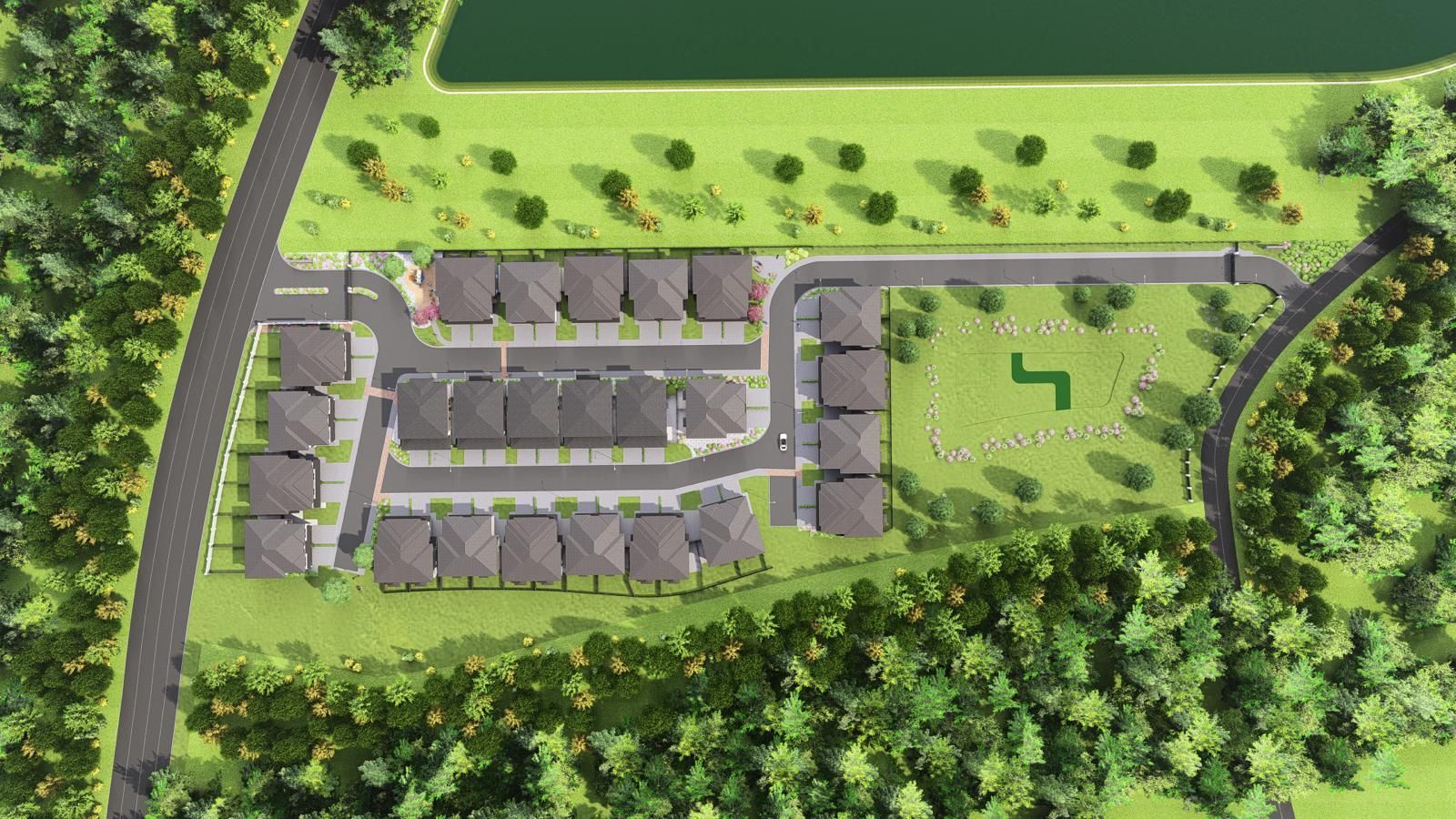 Aerial view of a suburban housing development beside a green park and tree-lined roads.