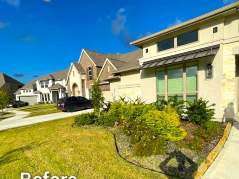 Residential home with landscaped front yard on a sunny day.