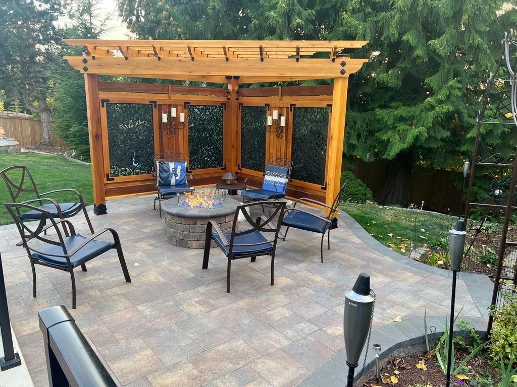 Pergola and paved patio with fire pit 