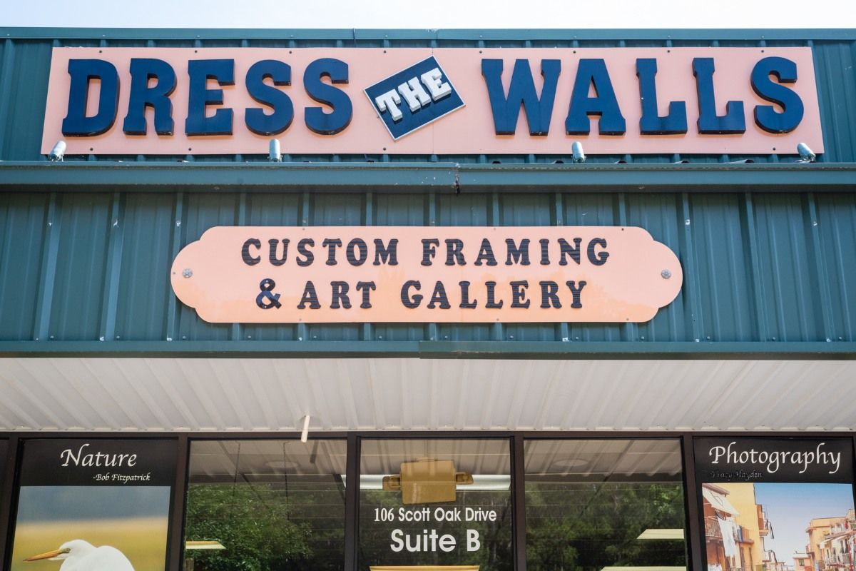 Storefront sign for Dress the Walls and Custom Framing & Art Gallery