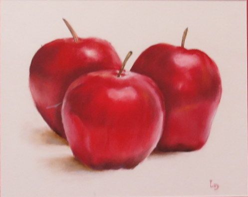 Three red apples on a white background