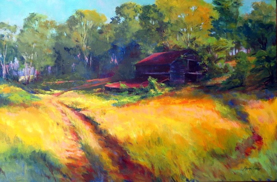 Sunlit field with tall golden grass, trees, and a small dark cabin in the background