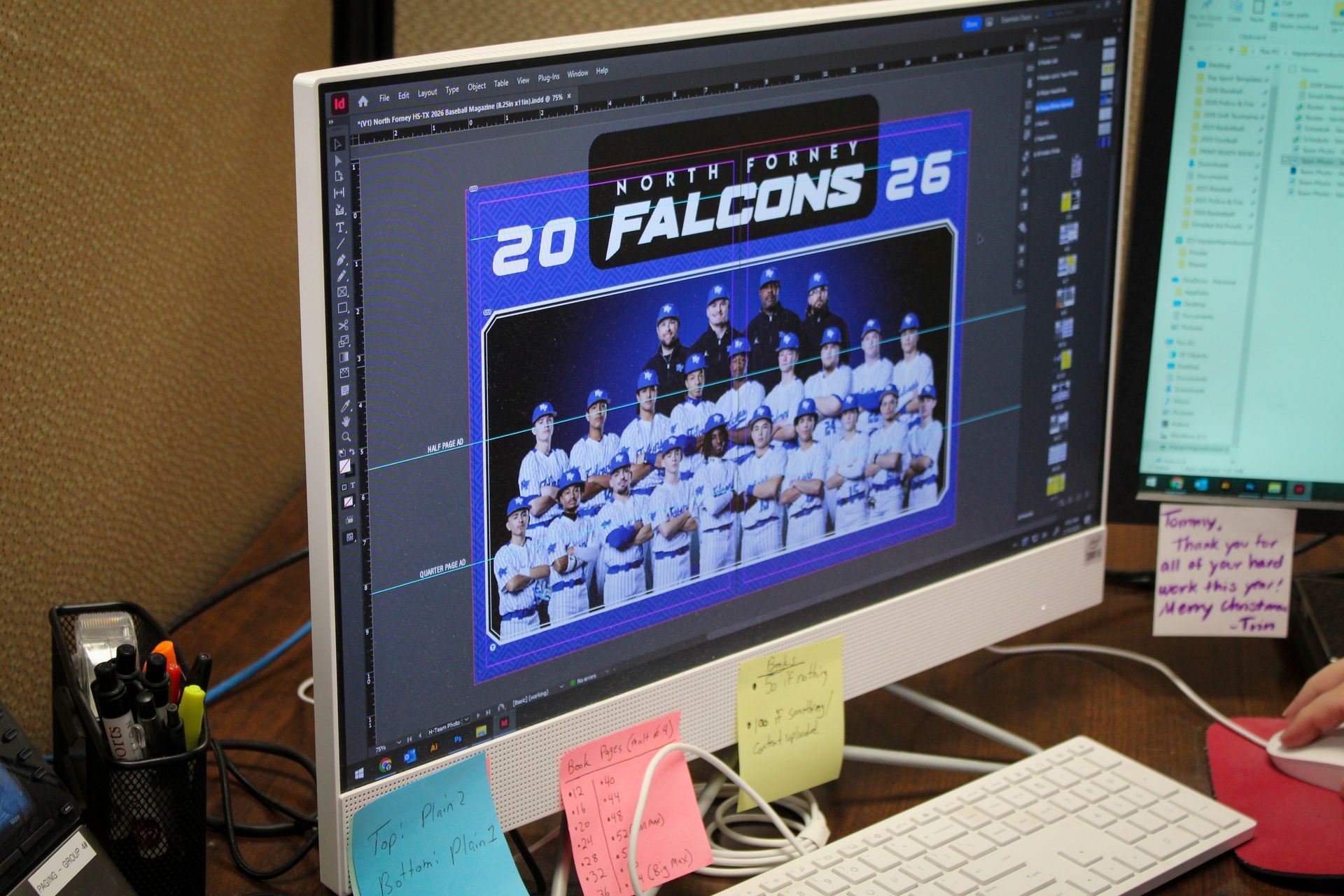 designers desktop working on a schools media guide layout