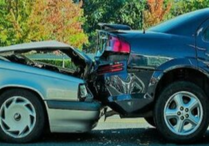 Picture of a silver car crashing into the back of a grey car.