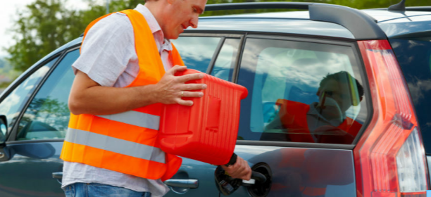 Picture of a vehicle having fuel delivered in a jerry can and being poured in the cars tank by a service provider.