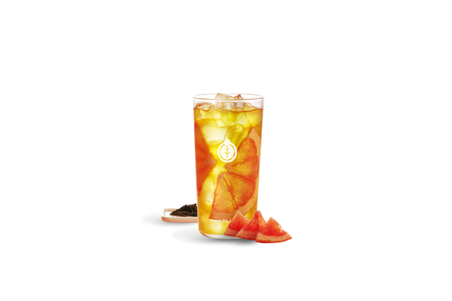 Bright grapefruit slices and citrus pulp complement a refreshing Taiwanese Grapefruit Green Tea over ice.