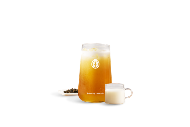 Creamy Taiwan's signature 33 King's Oolong Milk Tea with roasted oolong tea leaves and a cup of milk.