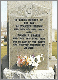 Solid ogee head in Light Grey granite with carved thistles in relief with the option of first letter of your surname.