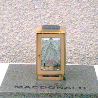 A Solar Powered Eternal Flame that flickers 24 hours 7 days a week encased in a solid bronze lantern. (Slip base optional extra).